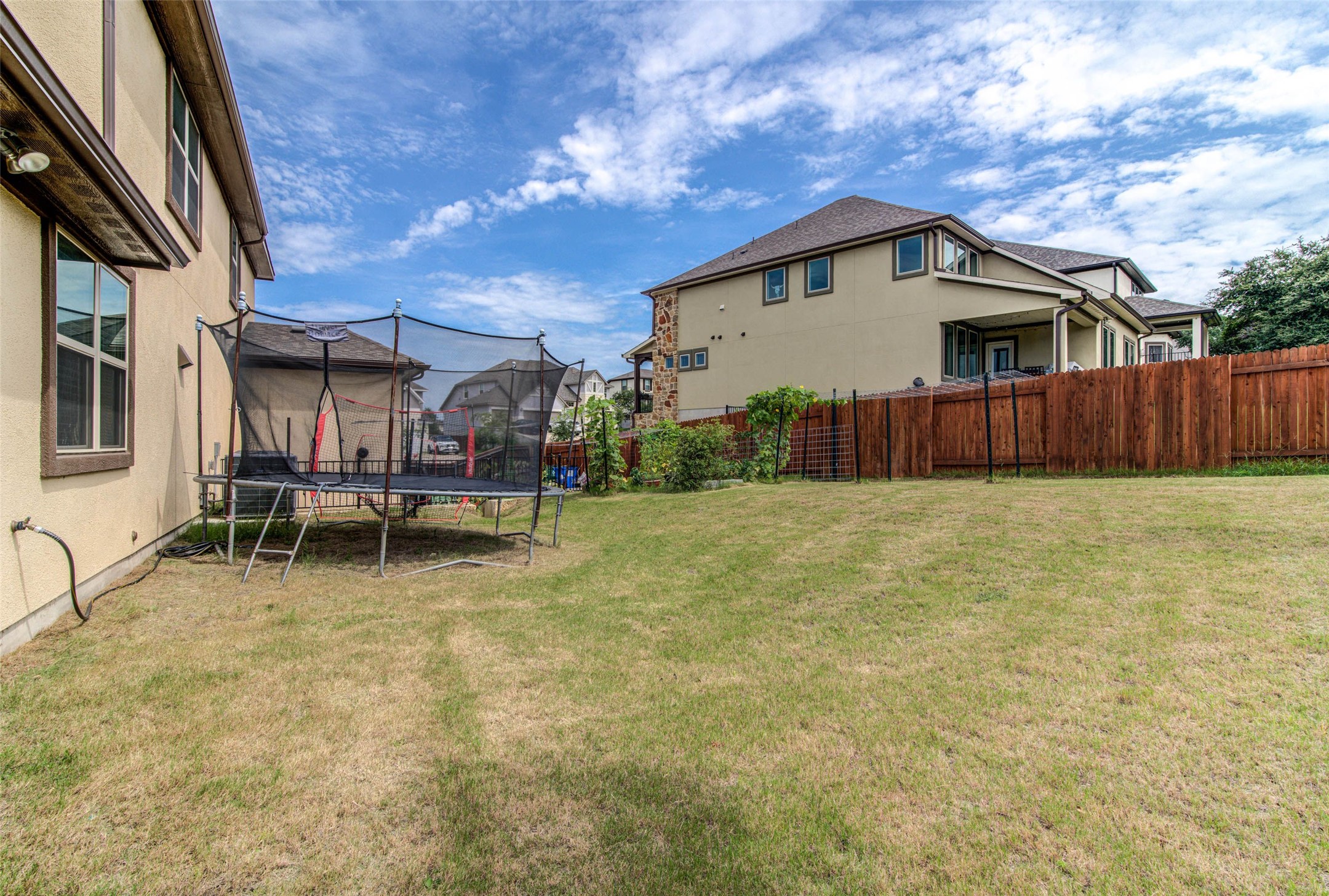 15621 Cabrillo Way Austin, TX 78738 - Photo 3 of 21 a backyard of a house with table and chairs