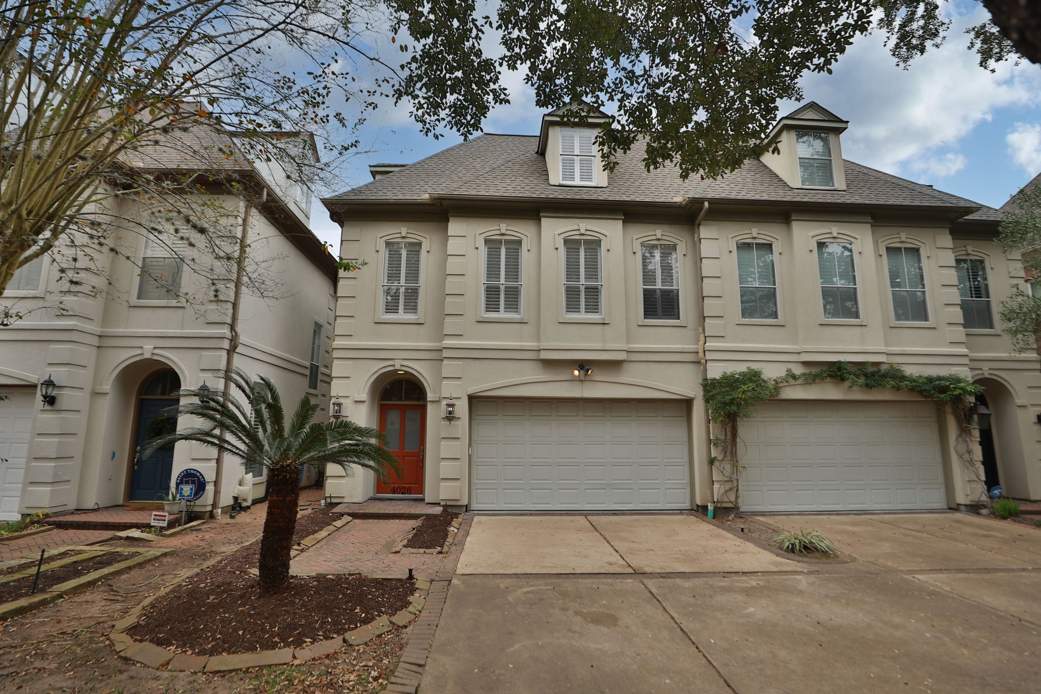 4026 Gramercy Street Houston, TX 77025 - Photo 2 of 35 a front view of a house with garden