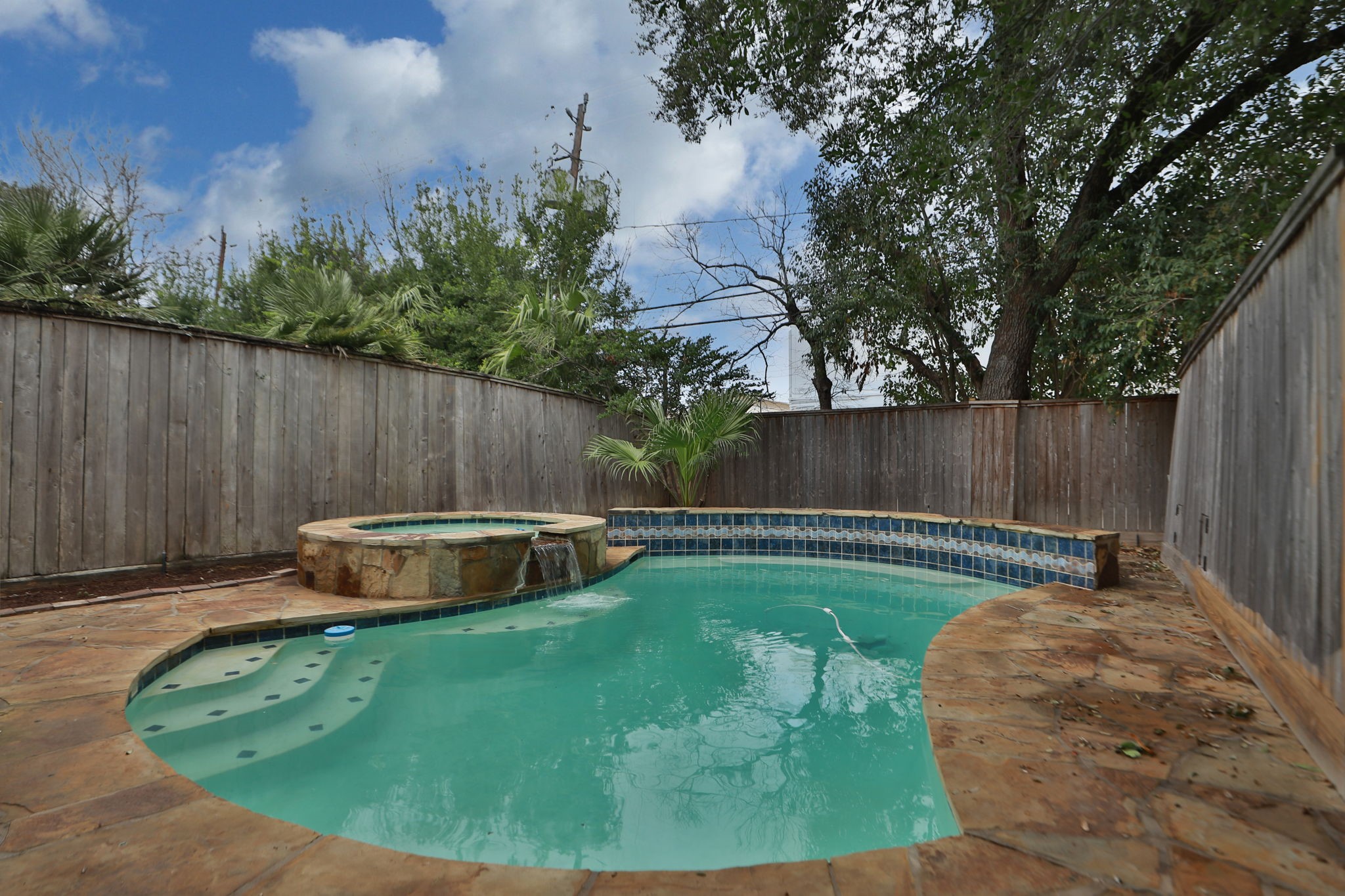 4026 Gramercy Street Houston, TX 77025 - Photo 32 of 35 a view of a backyard with swimming pool