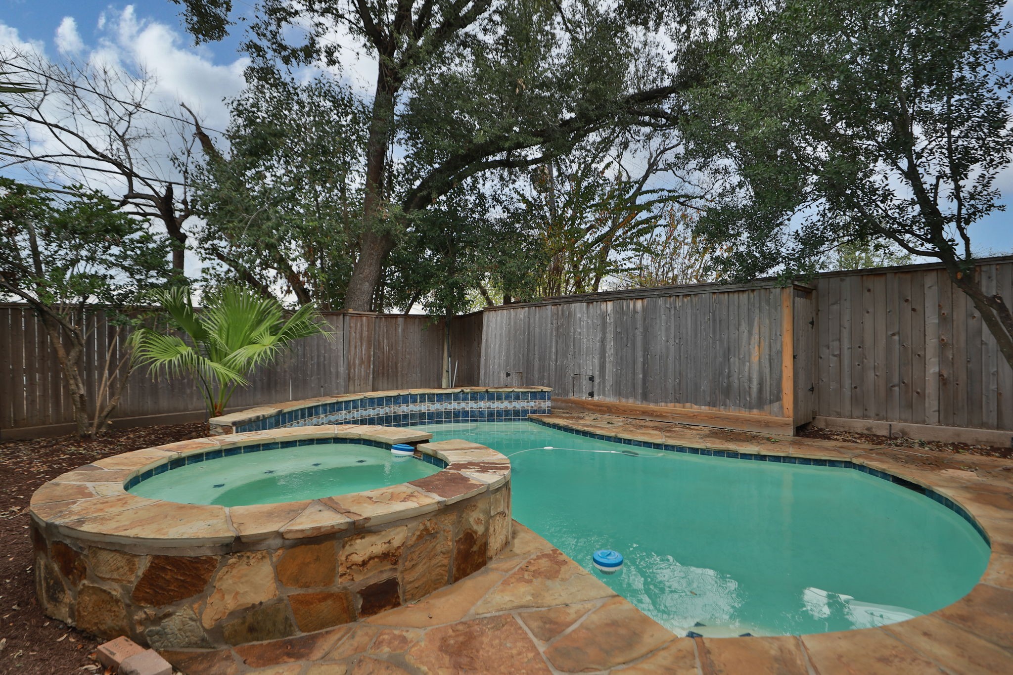 4026 Gramercy Street Houston, TX 77025 - Photo 33 of 35 a view of a swimming pool with a yard