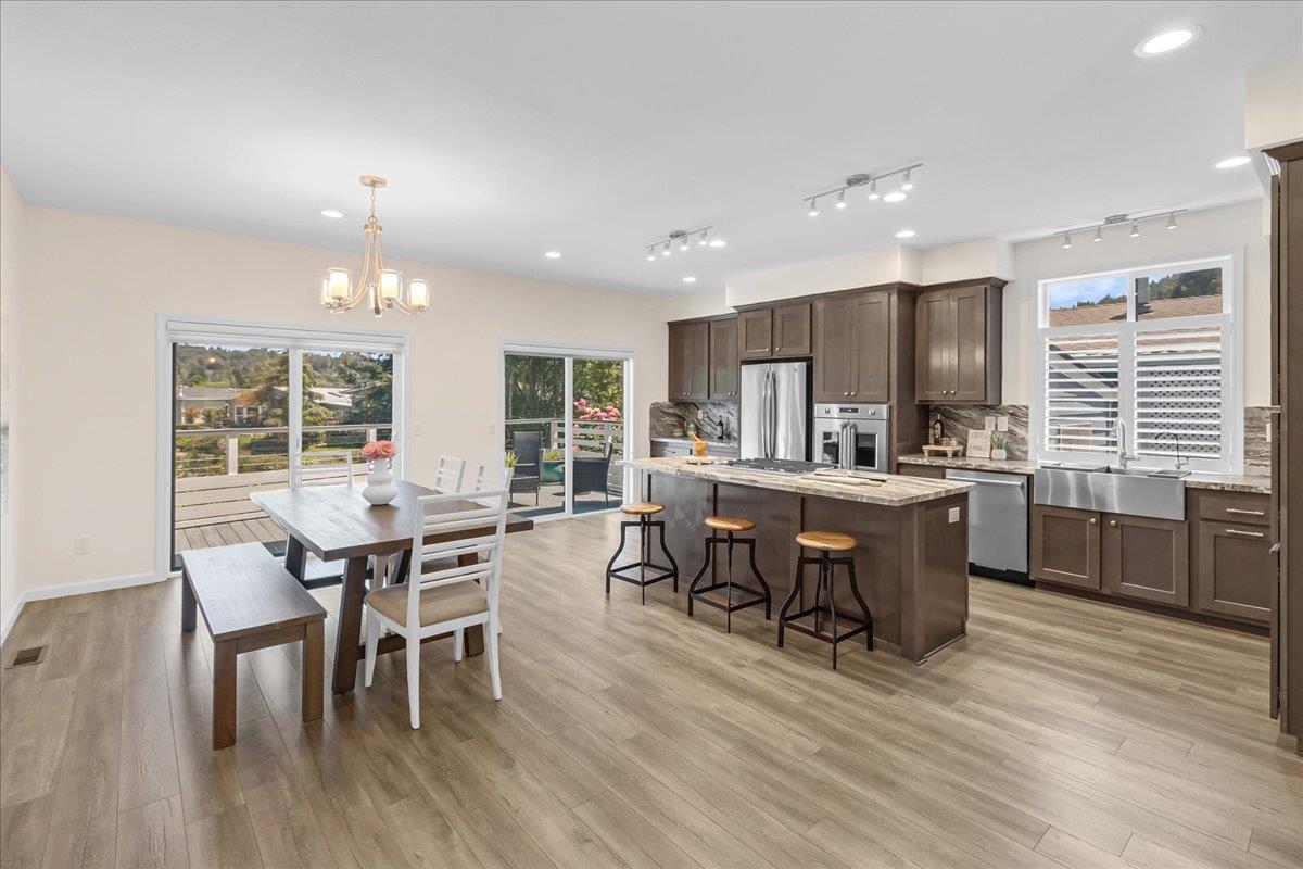 225 Mt Hermon Road, Unit 88 Scotts Valley, CA 95066 - Photo 20 of 50 a open dining room with stainless steel appliances wooden floors a table and chairs