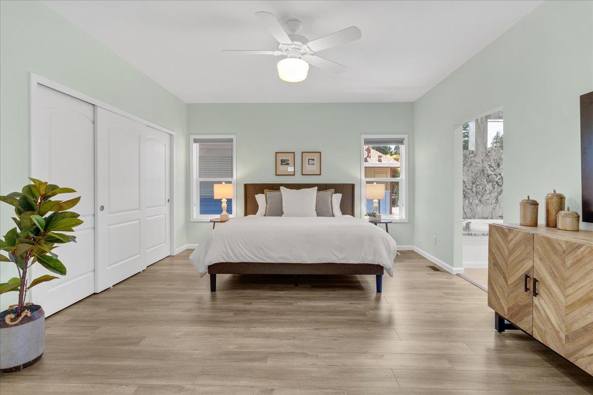 225 Mt Hermon Road, Unit 88 Scotts Valley, CA 95066 - Photo 21 of 50 a living room with a bed furniture and a potted plant