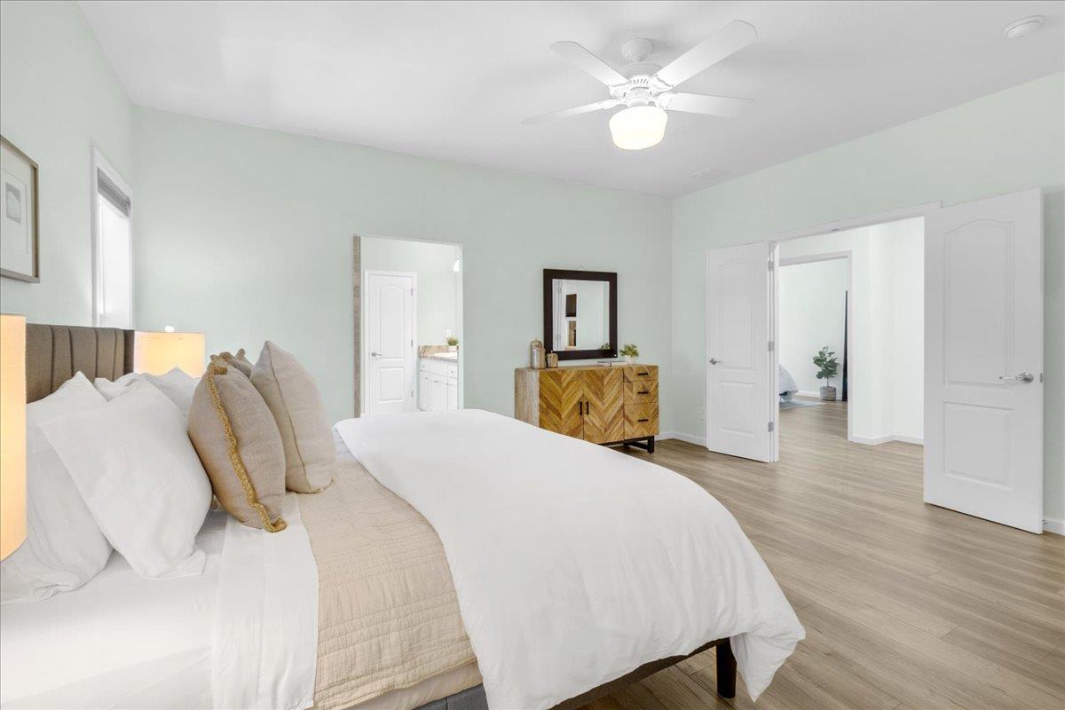 225 Mt Hermon Road, Unit 88 Scotts Valley, CA 95066 - Photo 23 of 50 a bed room with a bed and a chandelier