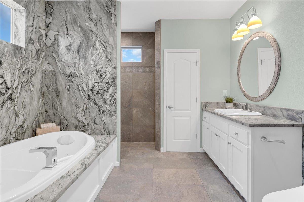 225 Mt Hermon Road, Unit 88 Scotts Valley, CA 95066 - Photo 24 of 50 a bathroom with a granite countertop sink and a mirror
