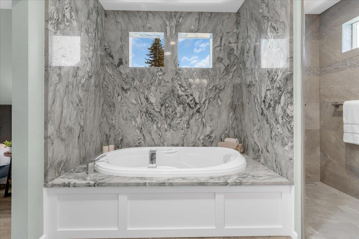225 Mt Hermon Road, Unit 88 Scotts Valley, CA 95066 - Photo 25 of 50 a bathroom with a granite countertop bathtub and shower