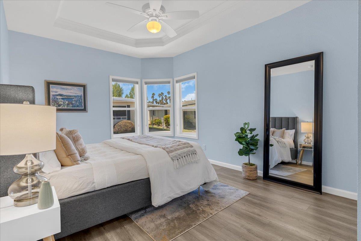 225 Mt Hermon Road, Unit 88 Scotts Valley, CA 95066 - Photo 29 of 50 a bedroom with a large bed and a potted plant