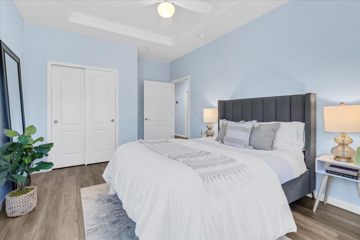 225 Mt Hermon Road, Unit 88 Scotts Valley, CA 95066 - Photo 30 of 50 a spacious bedroom with a bed and a potted plant