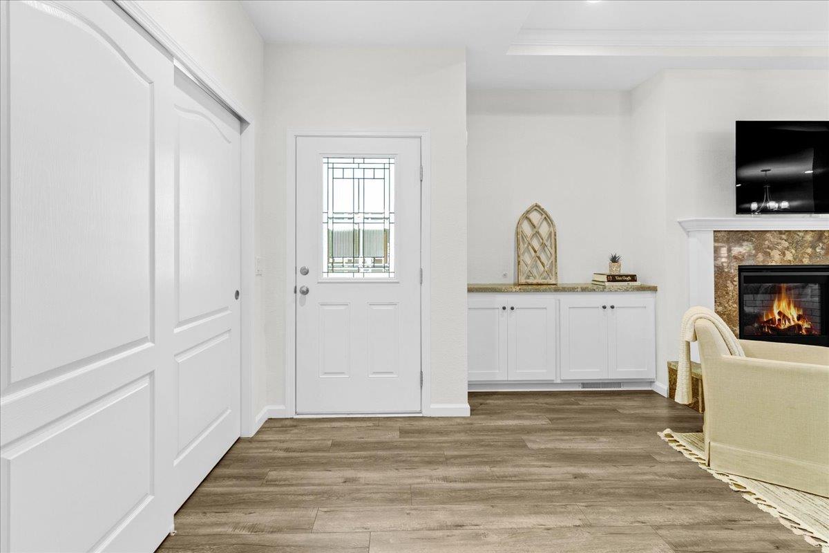 225 Mt Hermon Road, Unit 88 Scotts Valley, CA 95066 - Photo 9 of 50 a view of a kitchen with a sink a fireplace and wooden floor