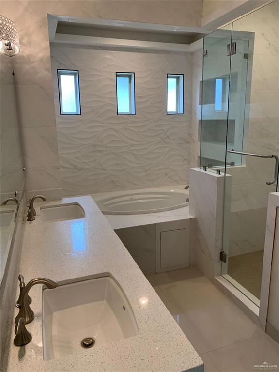 1304 Gran Via Street Pharr, TX 78577 - Photo 10 of 13 a bathroom with a tub and a shower