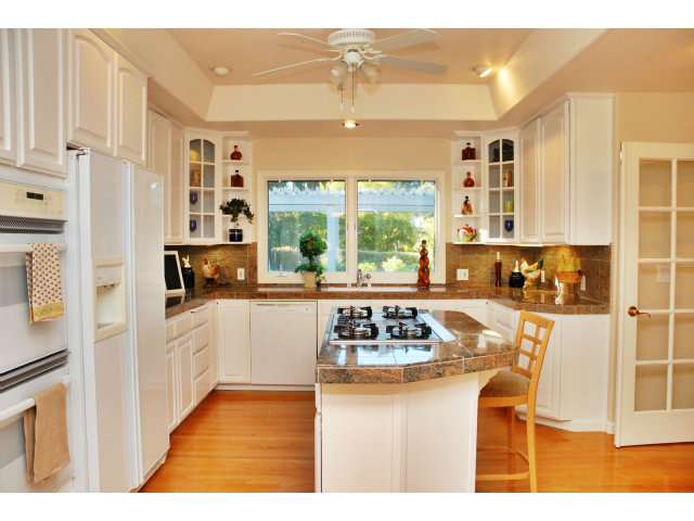 796 Nash Road Los Altos, CA 94024 - Photo 4 of 18 a kitchen with stainless steel appliances granite countertop a stove a sink and a refrigerator with wooden floor