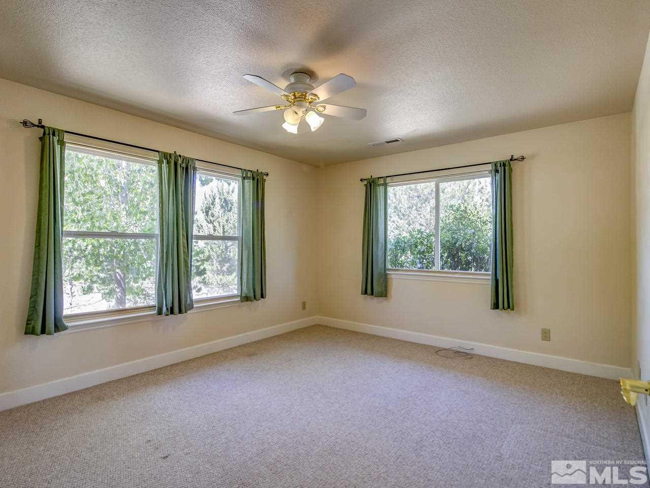 20575 Cooke Drive Reno, NV 89521 - Photo 11 of 25 wooden floor in an empty room with a window