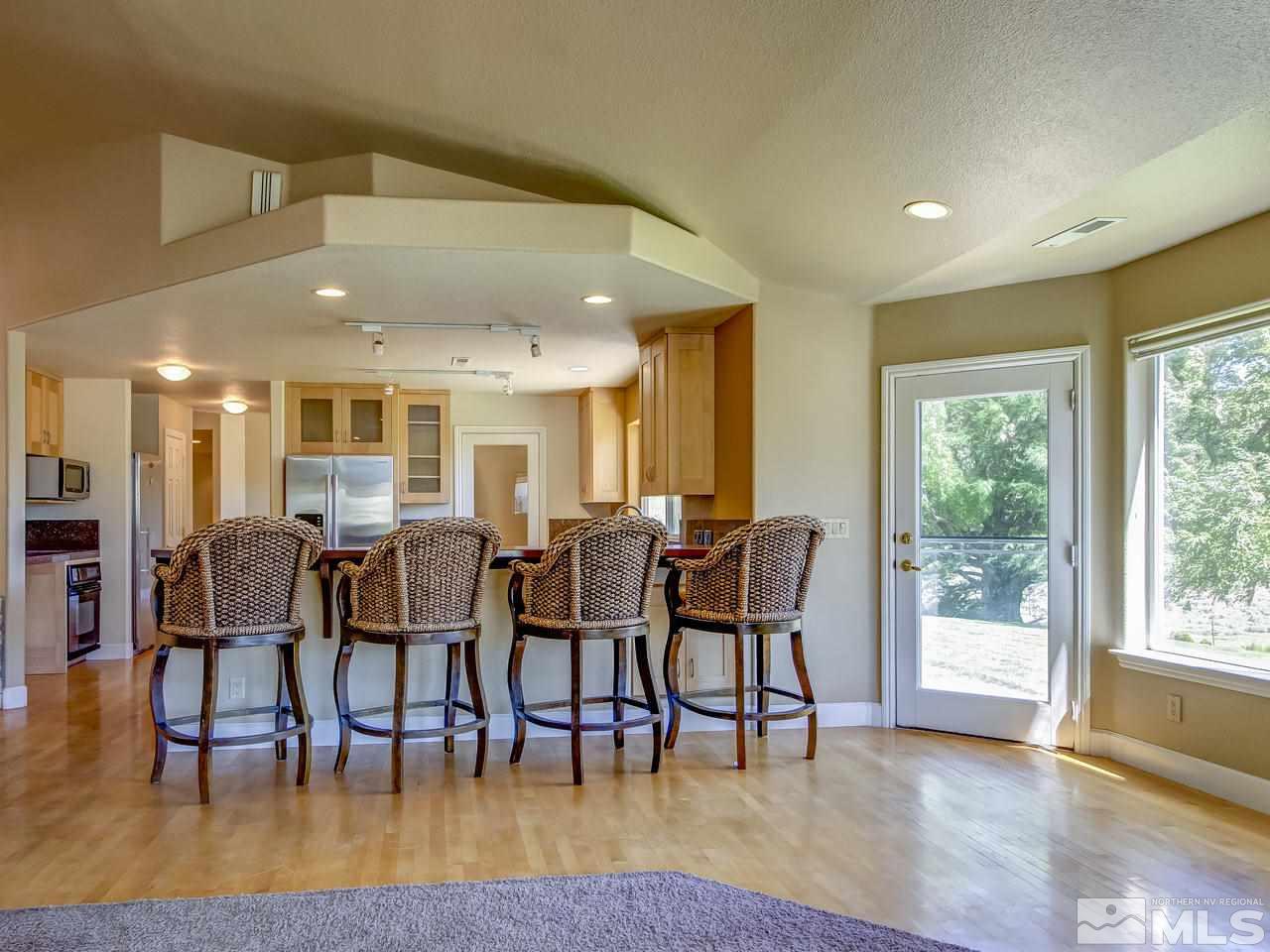 20575 Cooke Drive Reno, NV 89521 - Photo 4 of 25 a view of a dining area with furniture and wooden floor