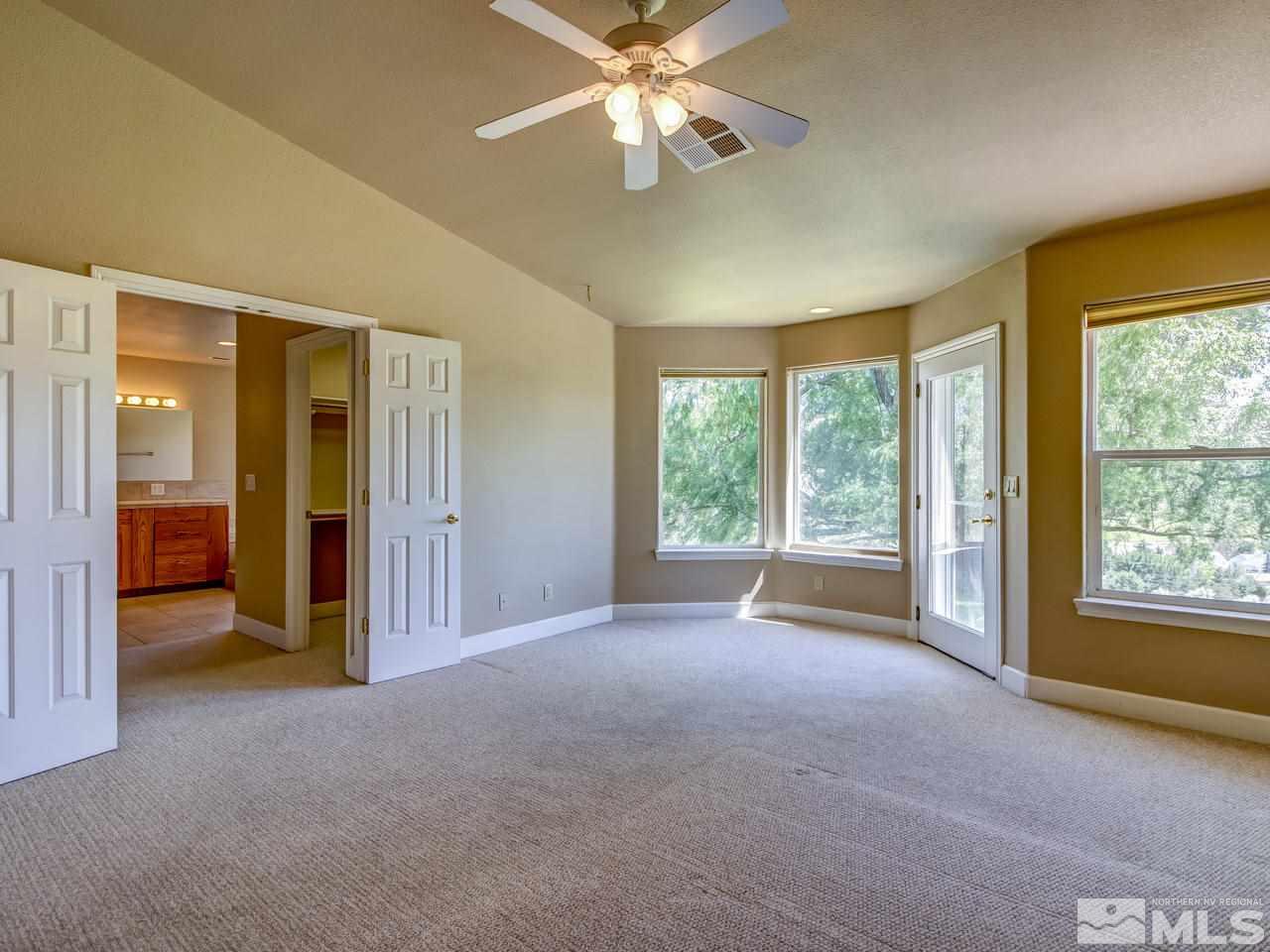 20575 Cooke Drive Reno, NV 89521 - Photo 8 of 25 a view of a livingroom with a ceiling fan and window