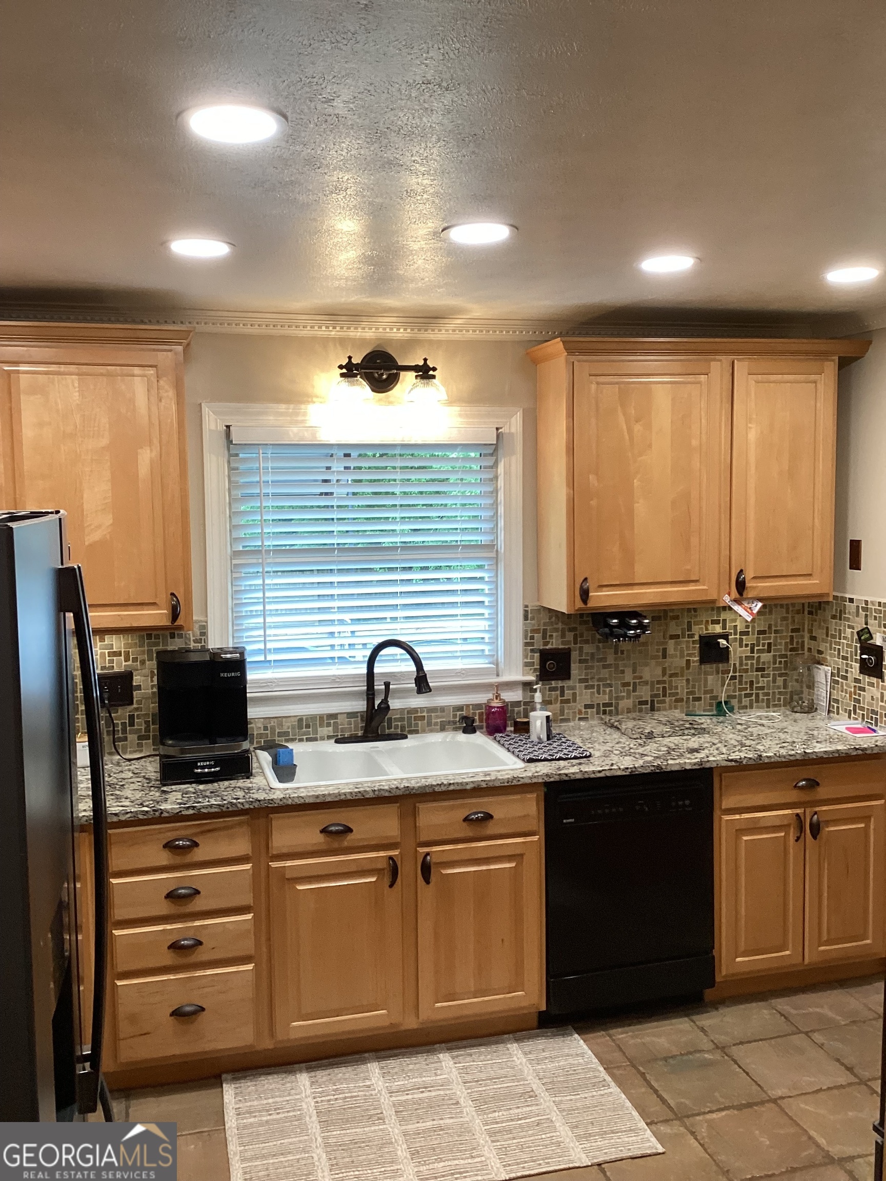 2779 Bob Cox Road Marietta, GA 30064 - Photo 13 of 48 a kitchen with stainless steel appliances granite countertop a sink and stove
