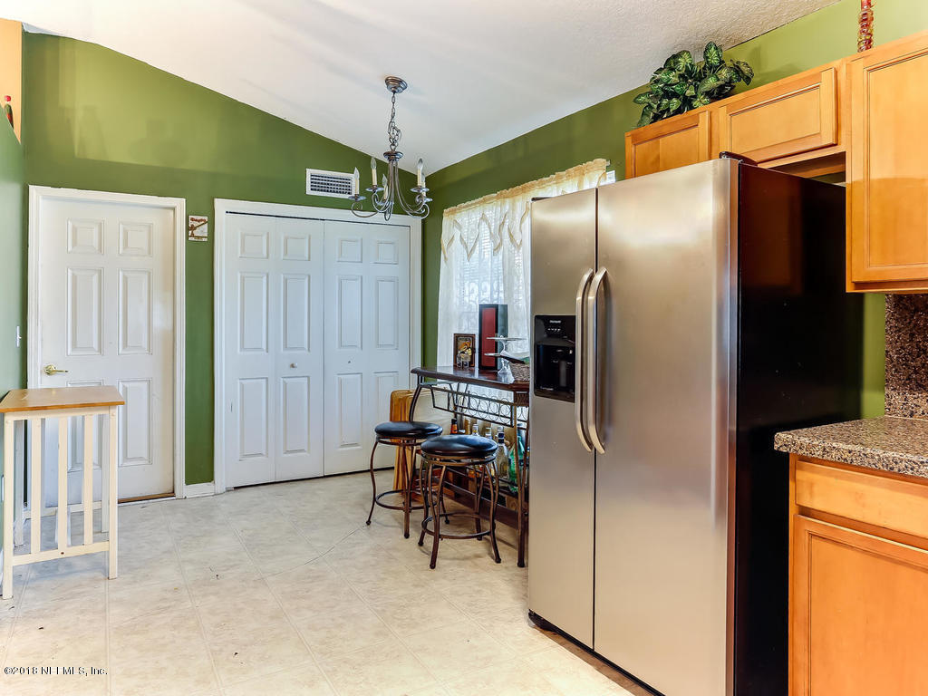 11873 Raindrop Road Jacksonville, FL 32219 - Photo 22 of 47 Kitchen with inside laundry