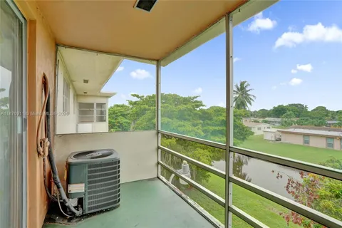 a view of a balcony with chairs