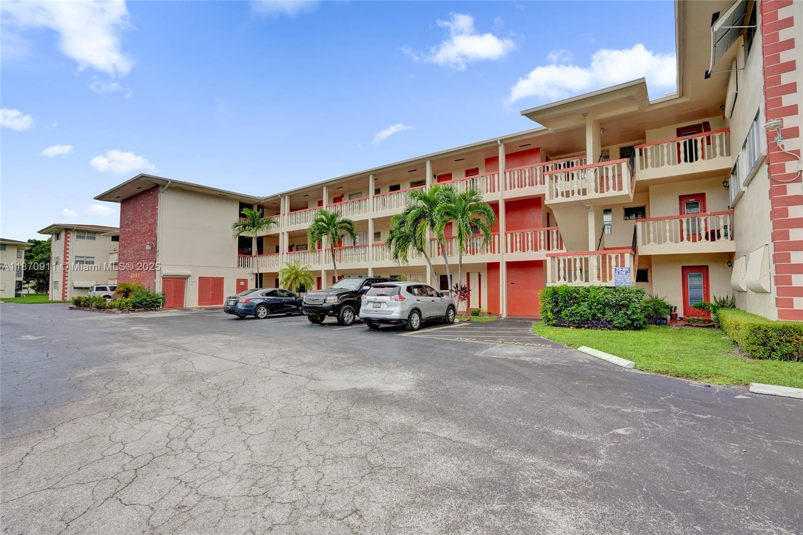 4731 Northwest 10th Court, Unit 314 Plantation, FL 33313 - Photo 24 of 26 a view of a car park in front of a building