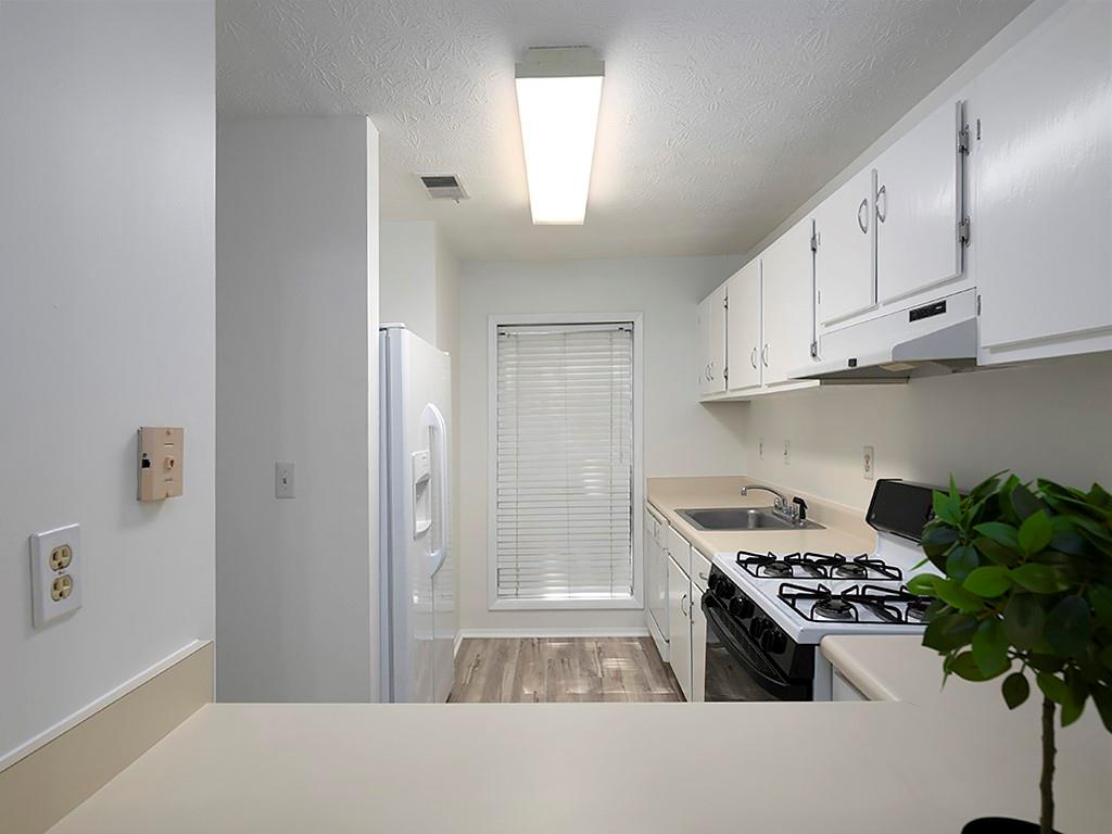 1316 Wynnes Ridge Circle Southeast Marietta, GA 30067 - Photo 12 of 29 a kitchen with stainless steel appliances granite countertop a refrigerator and a stove