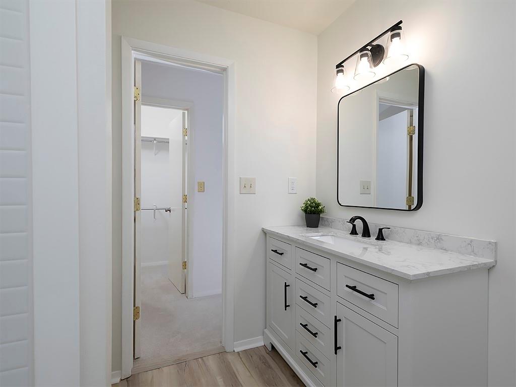1316 Wynnes Ridge Circle Southeast Marietta, GA 30067 - Photo 17 of 29 a bathroom with a double vanity sink and mirror