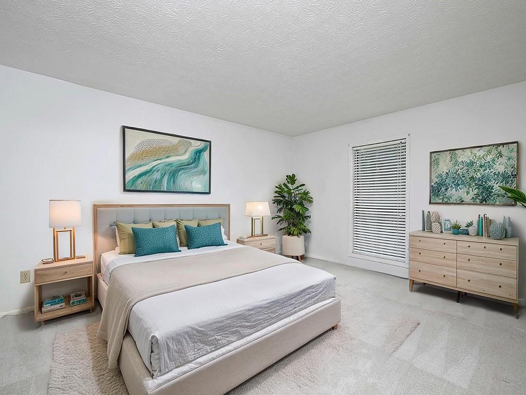 1316 Wynnes Ridge Circle Southeast Marietta, GA 30067 - Photo 18 of 29 a bedroom with a bed and a large window