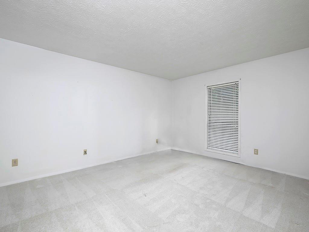 1316 Wynnes Ridge Circle Southeast Marietta, GA 30067 - Photo 19 of 29 an empty room with white walls