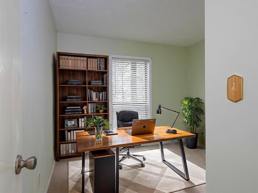 1316 Wynnes Ridge Circle Southeast Marietta, GA 30067 - Photo 22 of 29 a view of a workspace with a bookshelf