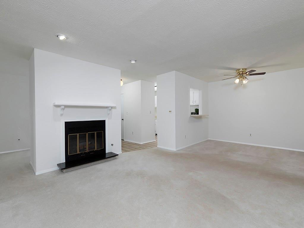 1316 Wynnes Ridge Circle Southeast Marietta, GA 30067 - Photo 6 of 29 a view of empty room with a fireplace