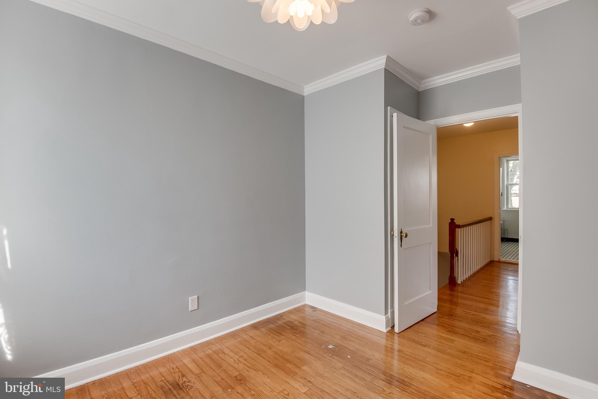 207 Blenheim Road Baltimore, MD 21212 - Photo 16 of 37 Bedroom One w/ hardwood and fresh paint