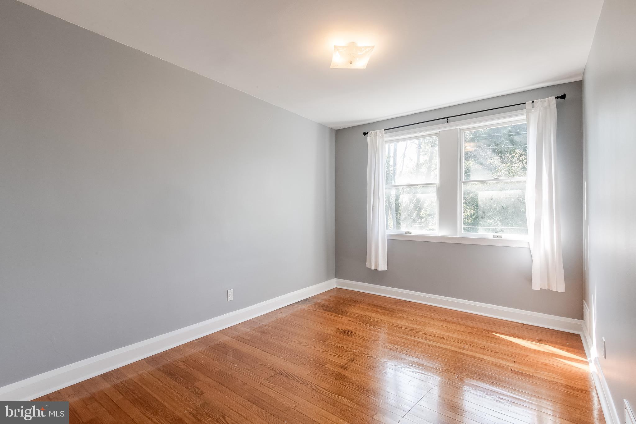207 Blenheim Road Baltimore, MD 21212 - Photo 17 of 37 Bedroom Two w/ hardwood and fresh paint