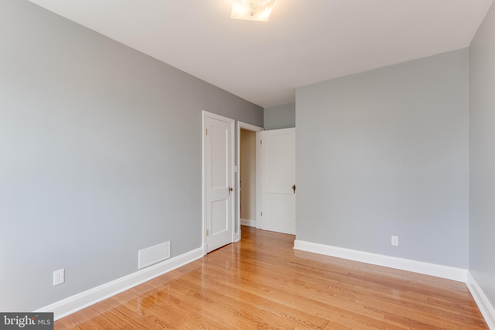 207 Blenheim Road Baltimore, MD 21212 - Photo 18 of 37 Bedroom Two w/ hardwood and fresh paint