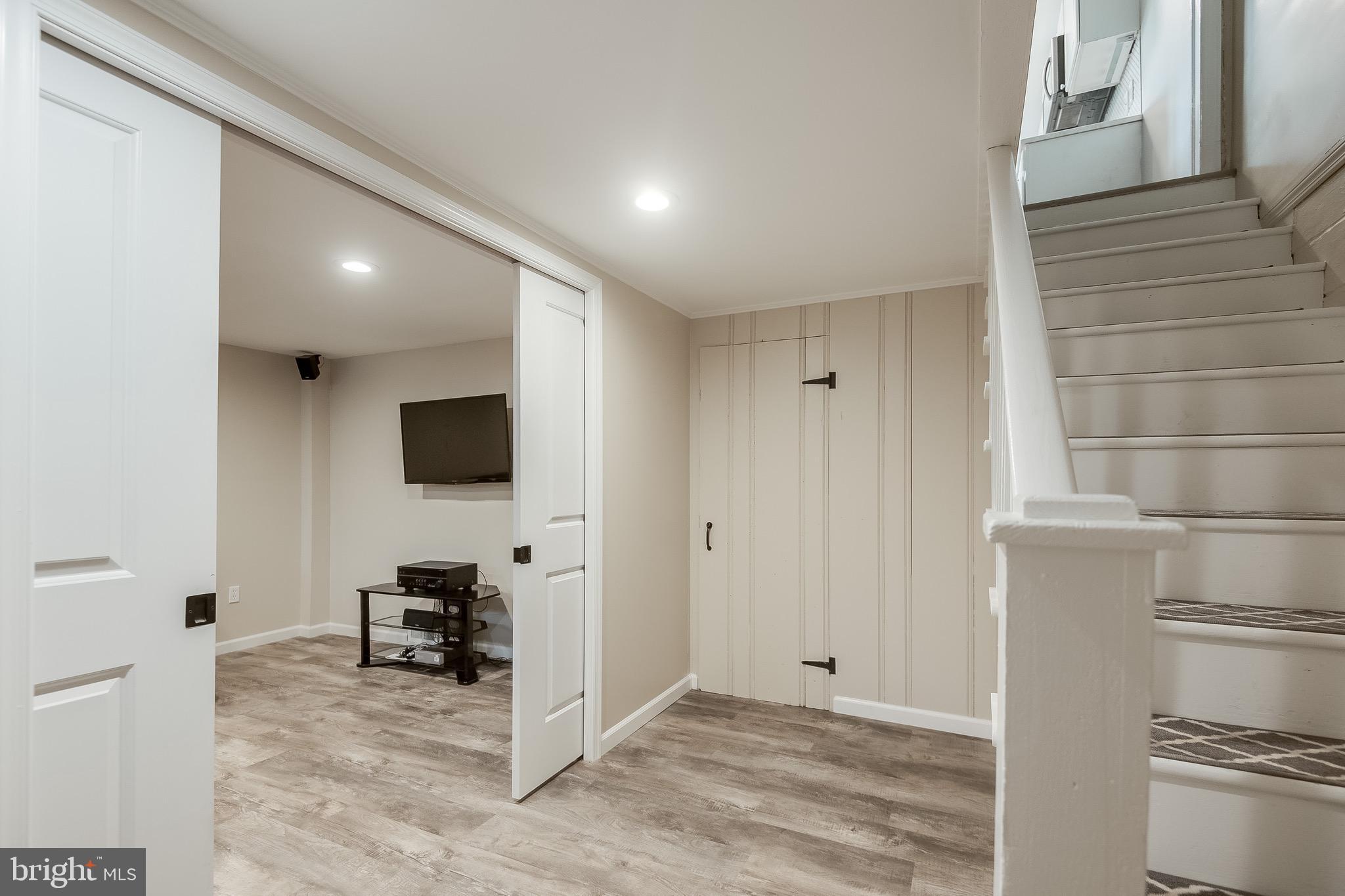 207 Blenheim Road Baltimore, MD 21212 - Photo 23 of 37 Rec Room at Lower Level w/ LVP Floors