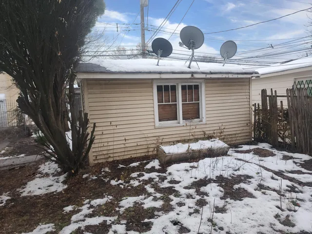a view of a house with a snow on the wall