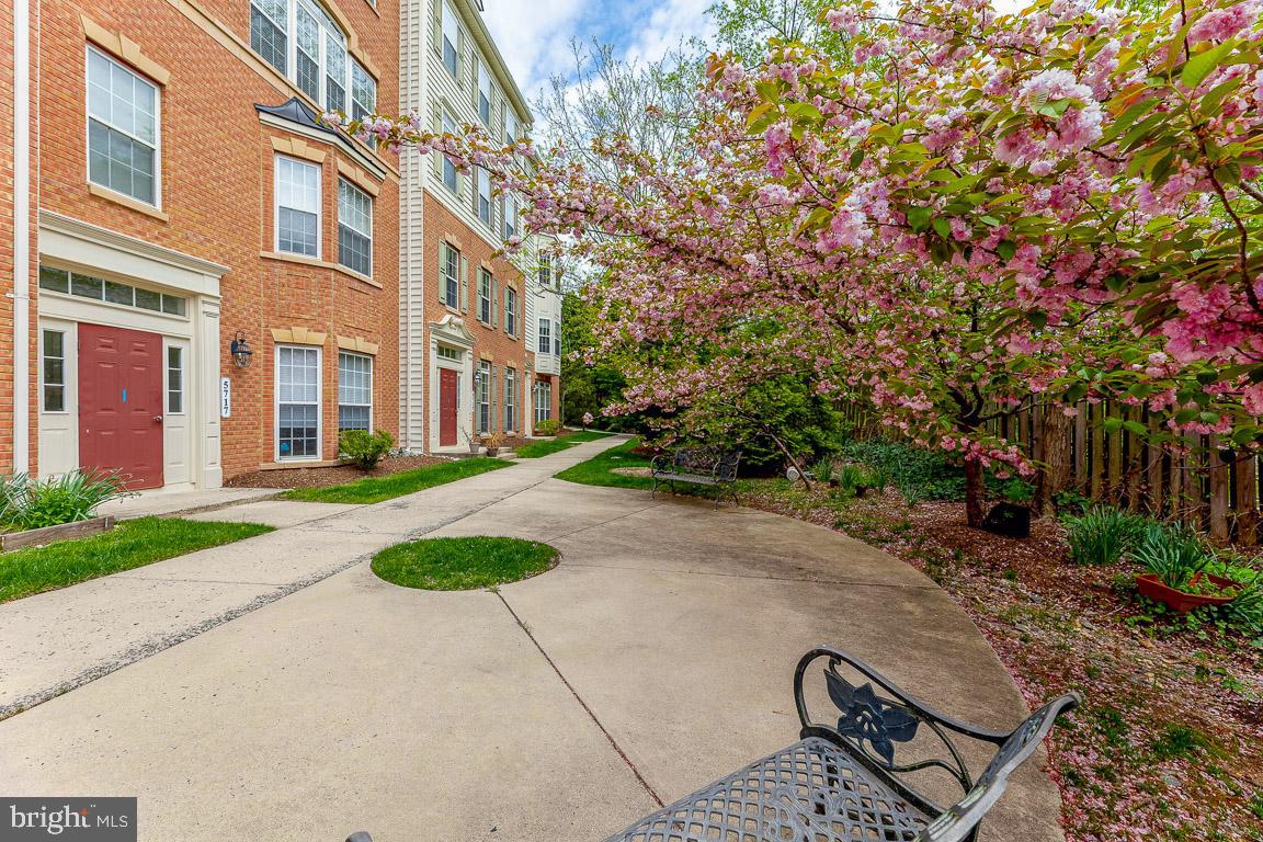 5713 Callcott Way, Unit B Alexandria, VA 22312 - Photo 3 of 53 a view of a building with a garden