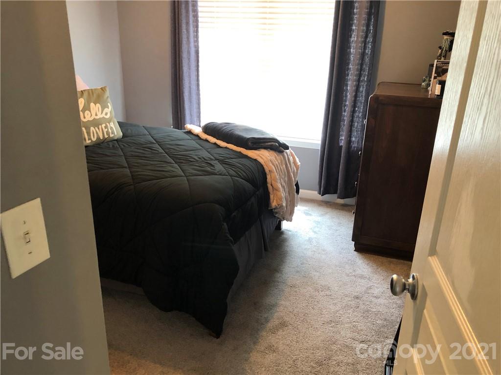 123 Chimney Rock Lane Fort Mill, SC 29708 - Photo 19 of 30 a bed sitting in a bedroom next to a window