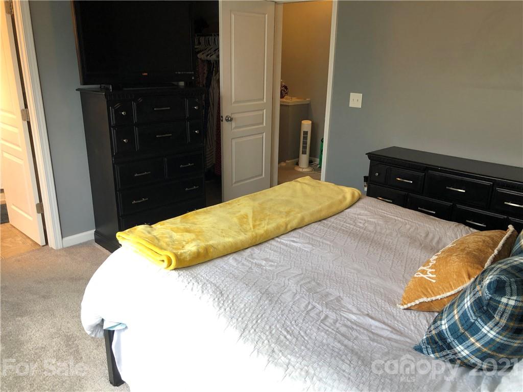 123 Chimney Rock Lane Fort Mill, SC 29708 - Photo 20 of 30 a bedroom with a bed and a dresser