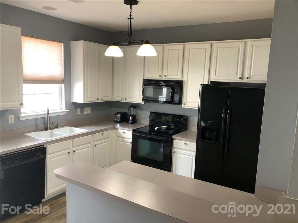 123 Chimney Rock Lane Fort Mill, SC 29708 - Photo 3 of 30 a kitchen with a sink a window and appliances
