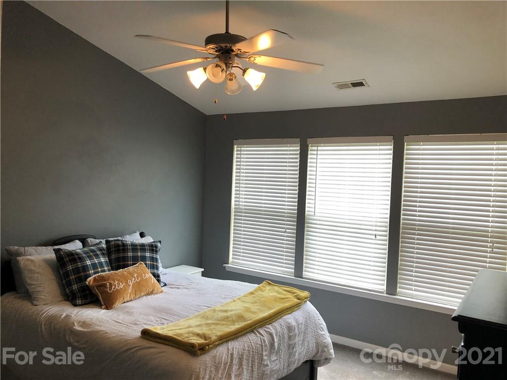 123 Chimney Rock Lane Fort Mill, SC 29708 - Photo 21 of 30 a bedroom with a large bed and a window
