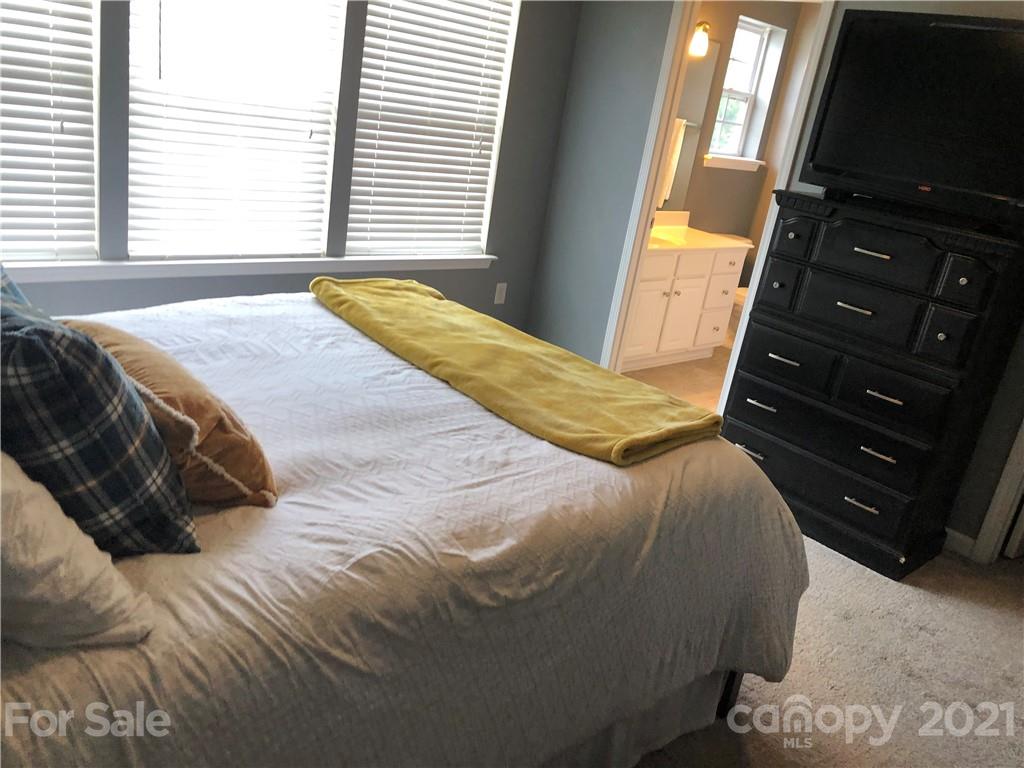 123 Chimney Rock Lane Fort Mill, SC 29708 - Photo 22 of 30 a bedroom with a bed window and dresser