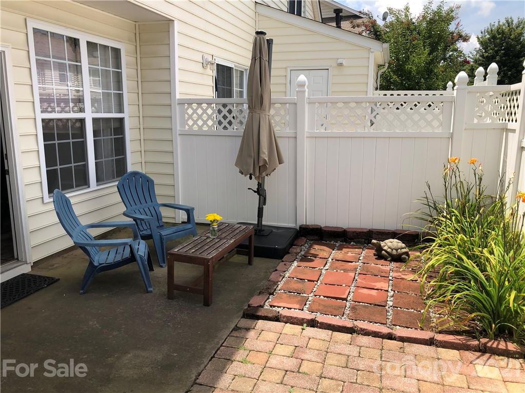 123 Chimney Rock Lane Fort Mill, SC 29708 - Photo 29 of 30 a backyard of a house with barbeque oven table and chairs
