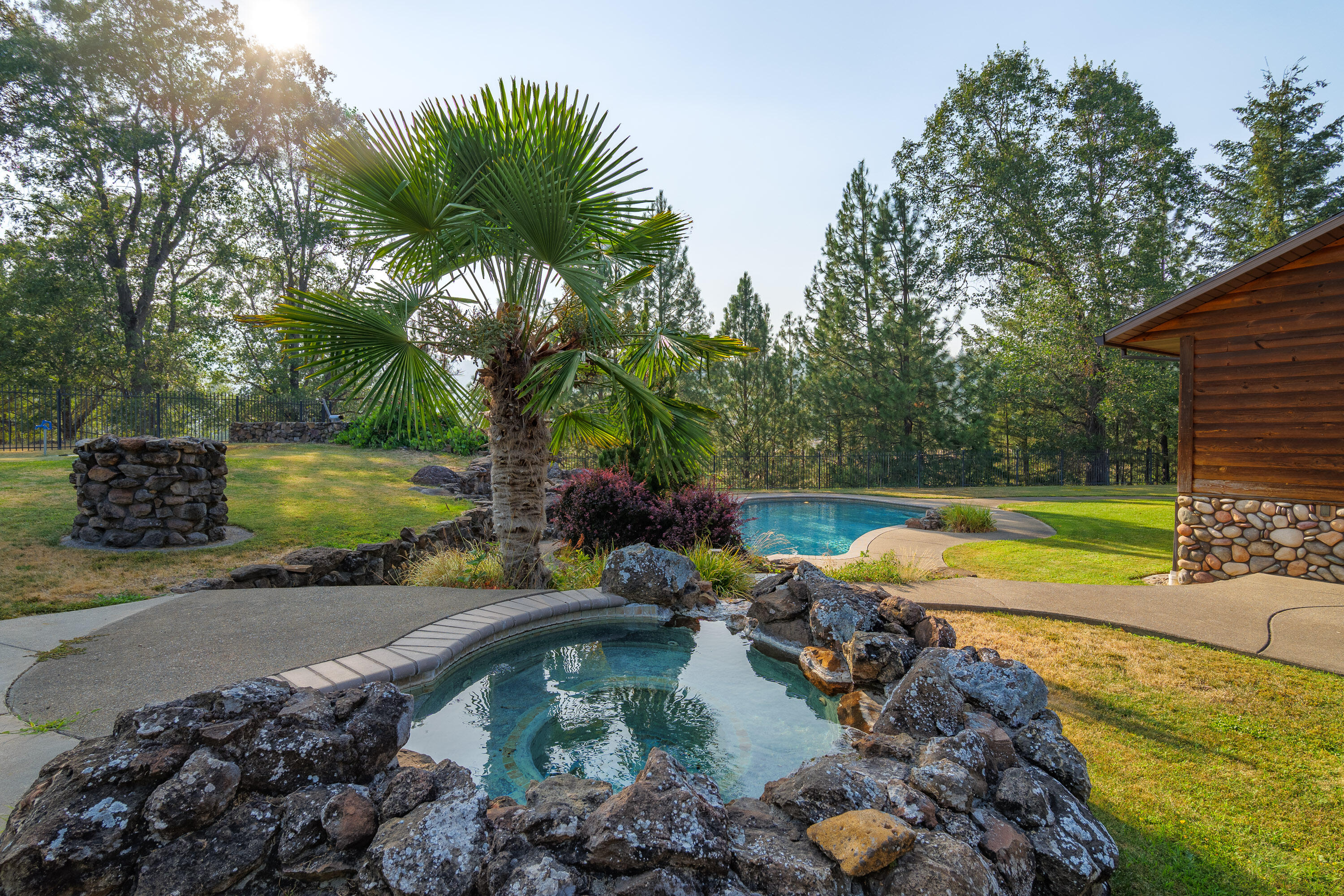 536 Ragsdale Road Trail, OR 97541 - Photo 42 of 67 a view of a swimming pool with a patio and a yard