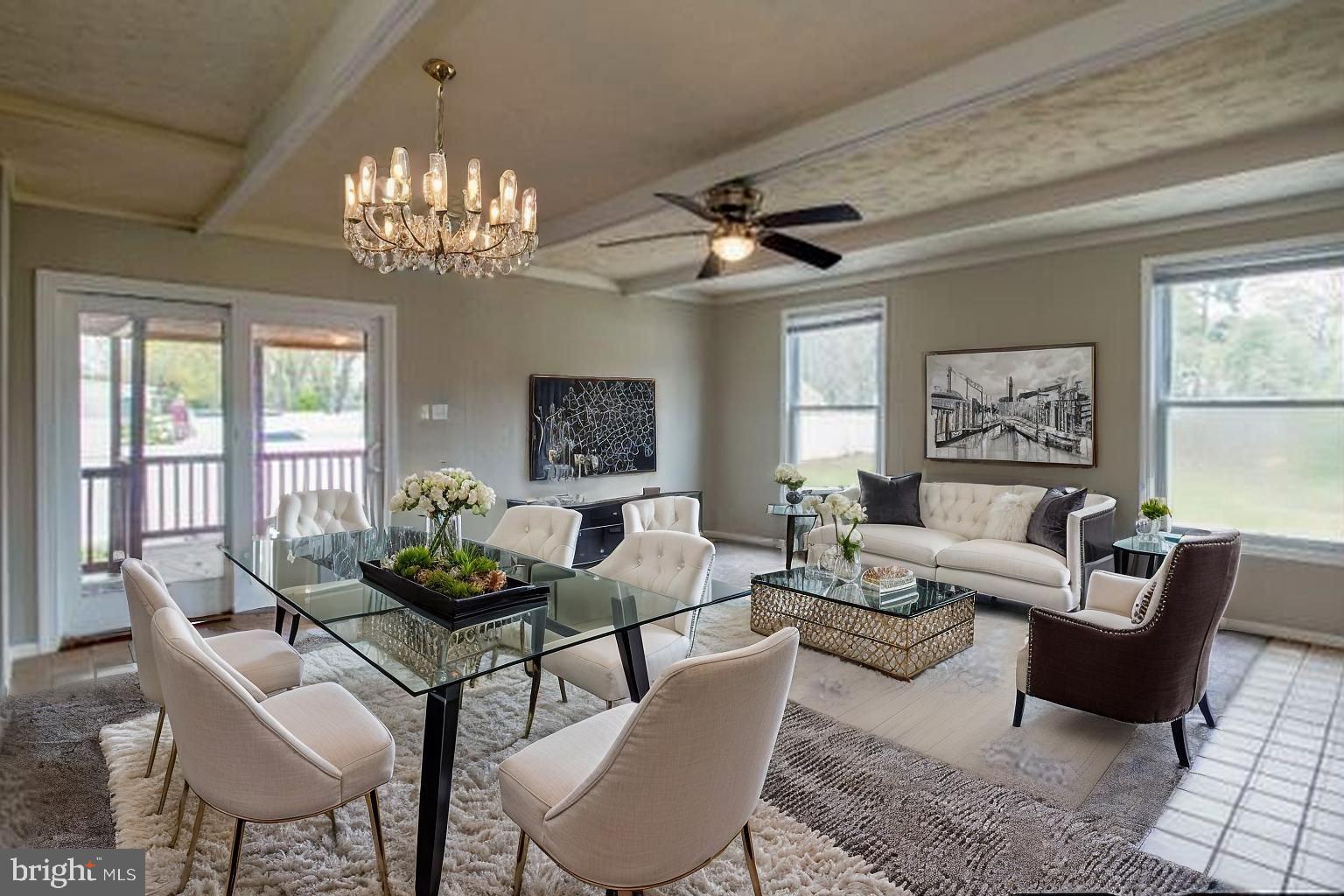 509 Spruce Avenue Pitman, NJ 08071 - Photo 7 of 25 a living room with furniture and a chandelier