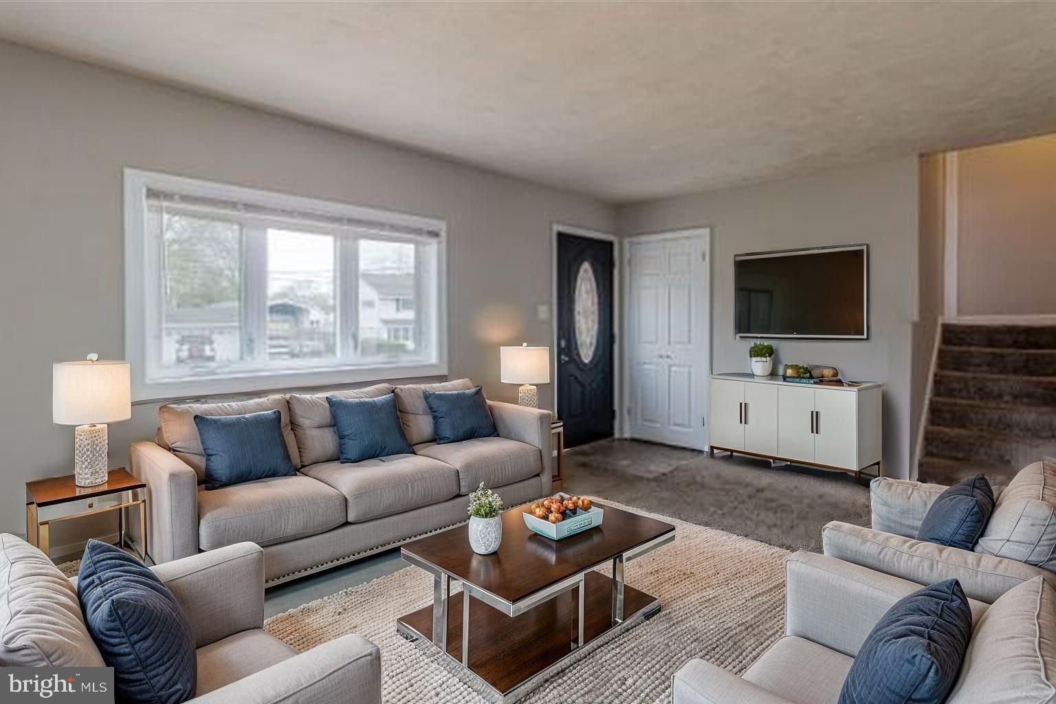 509 Spruce Avenue Pitman, NJ 08071 - Photo 8 of 25 a living room with furniture and a flat screen tv