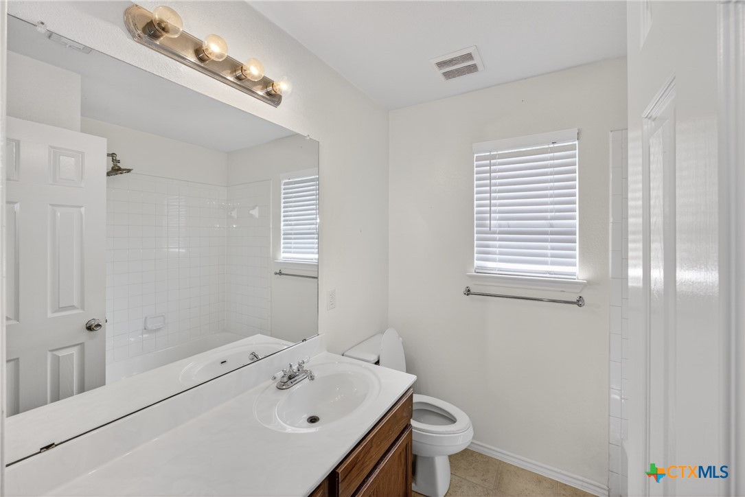 7015 Rickey Drive Temple, TX 76502 - Photo 23 of 29 a bathroom with a sink a toilet and shower