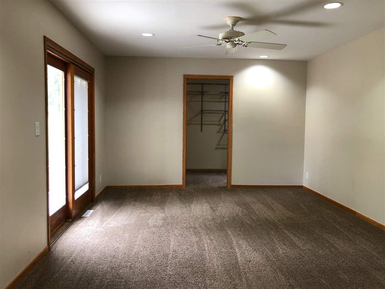 1733 Lake Summerset Road Davis, IL 61019 - Photo 10 of 24 an empty room with wooden floor and windows