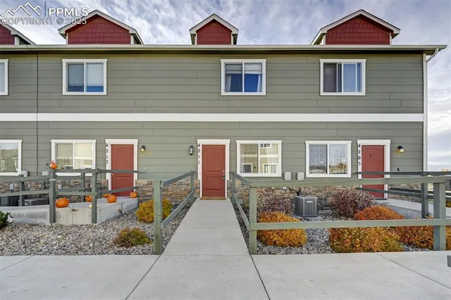 a view of multiple houses with city street