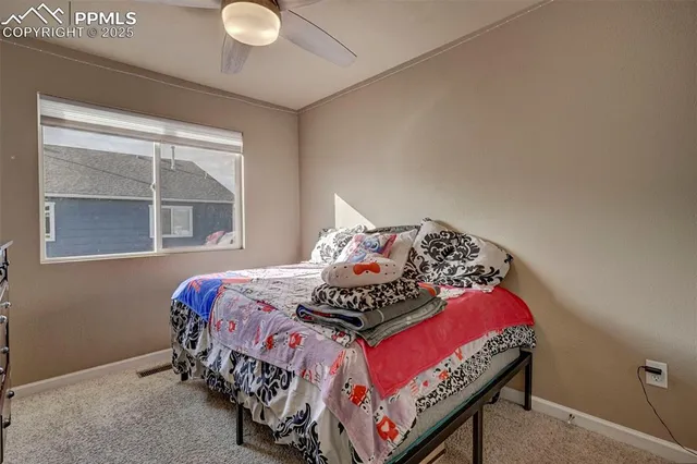 a bedroom with a bed and flat screen tv