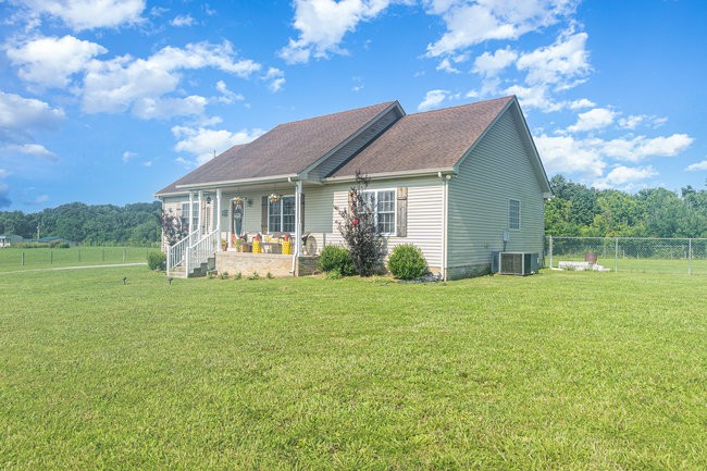 626 West Harper Road Portland, TN 37148 - Photo 11 of 26 a front view of a house with garden