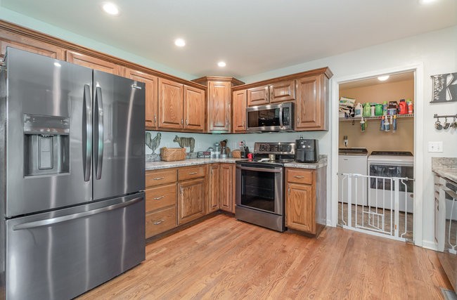 626 West Harper Road Portland, TN 37148 - Photo 17 of 26 a kitchen with stainless steel appliances granite countertop a refrigerator sink and microwave