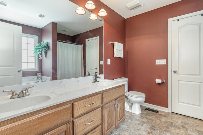 626 West Harper Road Portland, TN 37148 - Photo 20 of 26 a bathroom with a sink and a mirror