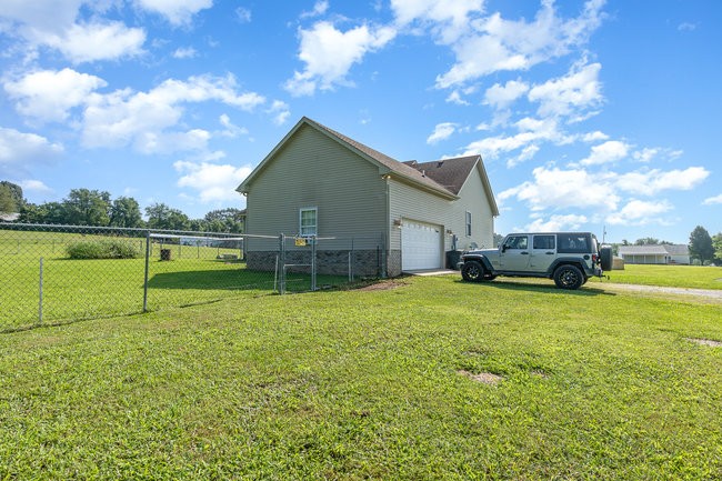 626 West Harper Road Portland, TN 37148 - Photo 25 of 26 a view of a house with a yard